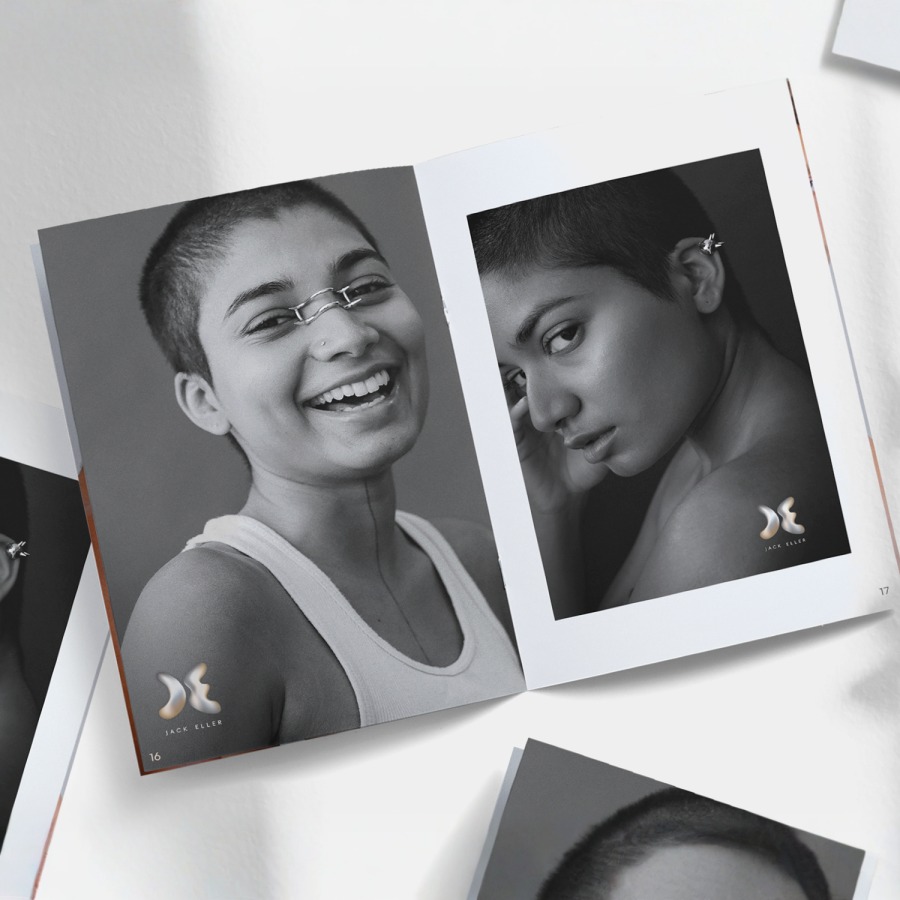 A spread out A4 booklet featuring black and white portraits of a model. 