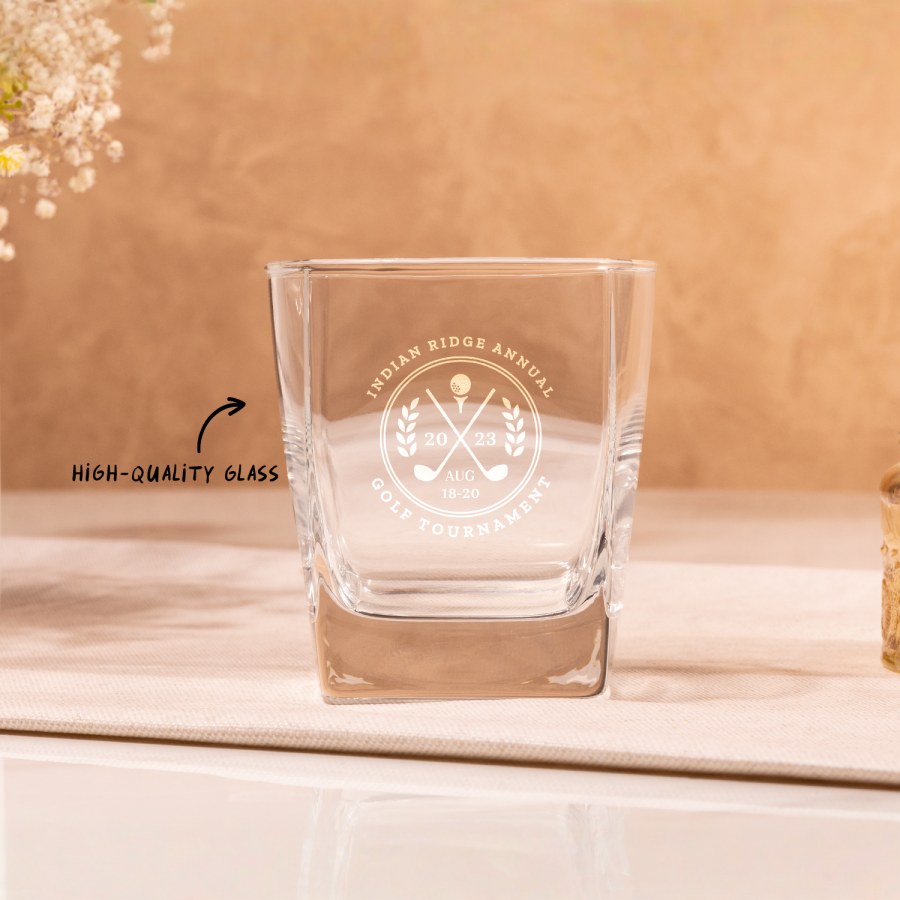 A tumbler personalised for a golf tournament, with a text call out that reads; "made from high-quality glass".