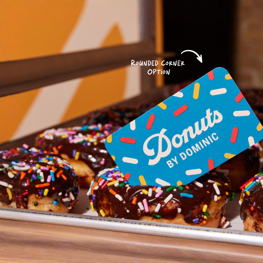 A business card promoting a donut shop.