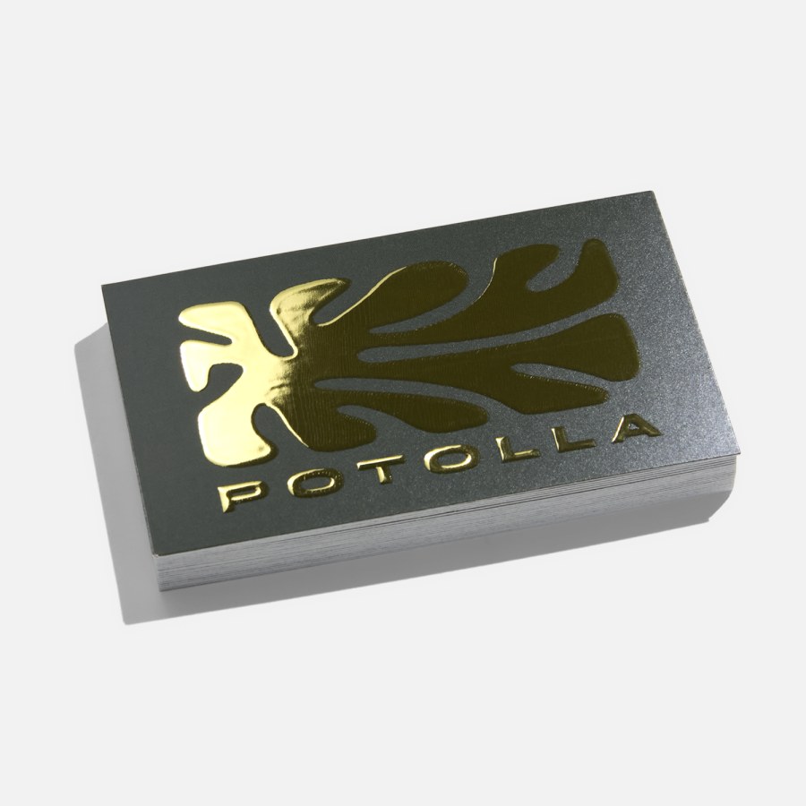 A business card printed with a raised foil logo and text.