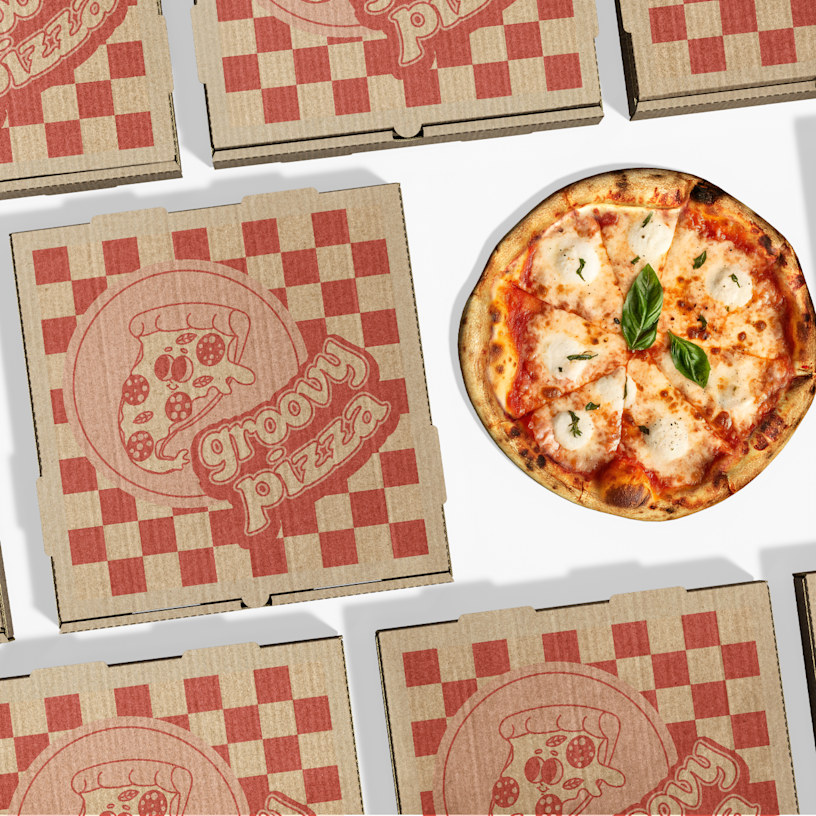 A variety of different branded pizza boxes top side up.