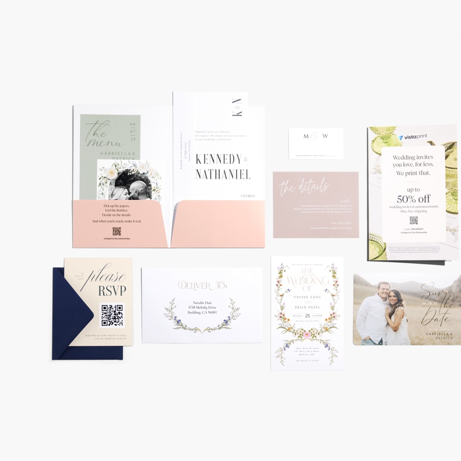 A spread of various wedding cards in different styles, including an invitation, save the date card, RSVP card and details card. 