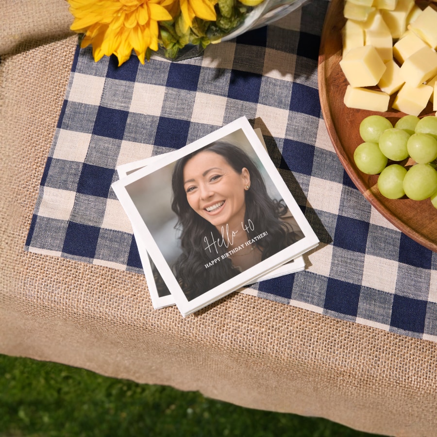 A stack of cocktail napkins personalized for a 40th birthday party. 