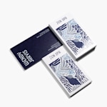 Embossed gloss business cards from a spa, with an intricate embossed gloss design on the front and a clean finish with details on the back.