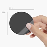 A person holding a circle business card, labeled by its size.