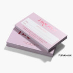 Two stacks of foil accent appointment cards for a beauty business, one showing the front and one showing the back.