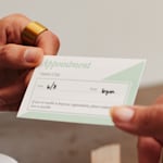 An appointment reminder card for a salon, with a note that it’s easy to write on.