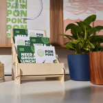 A display of postcards for a restaurant. 6 different sizes are shown.