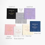 An assortment of foil napkins printed with different base colors and foil colors.