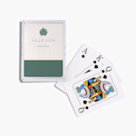 A stack of playing cards customized with the logo of a luxury resort. 