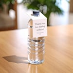 A water bottle displaying a bottle neck tag.