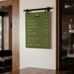 A menu board showing a menu for a coffee shop with pricing.