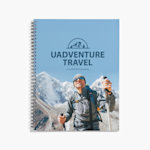 A spiral-bound adventure travel guide, with a mountaineer on the cover.