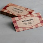 A kraft business card with a colorful pattern from a bespoke designer.