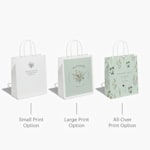 3 party bags from a wedding celebration featuring floral patterning and filled with salmon tissue paper.