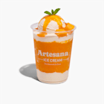 A plastic ice cream cup with vanilla ice cream and blueberry syrup and toppings.