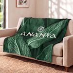 A blanket customized for a spa draped over a waiting room couch. 