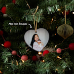Six different Christmas ornaments featuring photos and text, side by side. An arrow points to the porcelain material. 