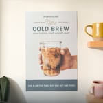 A bright yellow poster hanging on a brick wall promoting an art exhibition. Highlighted benefits include vivid printing, easy upload, more sizes and papers and fast, free shipping.