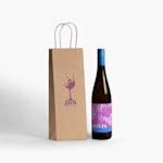 A brown kraft wine bag with a bottle of wine next to it.