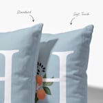 Woman holding a stack of custom printed cushions each featuring a different personalised photo on pillow design