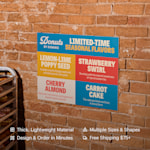 A custom foam board for a donut shop business hung on a wall. Highlighted benefits include: thick, lightweight material, design & order in minutes, multiple sizes & shapes, and free shipping $100+. 