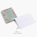 A holiday party invitation with a gingerbread motif and a white envelope, with a note that you can add free white envelopes. 