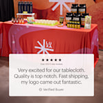 A custom tablecloth promoting a business named Luxa. It features a customer testimonial about top-notch quality and fast shipping.