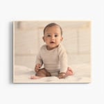 A custom wood print featuring a baby photo. 