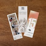 Three bookmarks customized for a bookshop, a consulting firm, and a family. Proof points: 100s of designs, easy photo uploads, vivid photo and logo printing and free shipping on orders of $100 or more. 