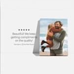 A canvas print featuring a photo of a father and his daughter at the beach, and a customer review: “Beautiful! We keep getting compliments on the quality!”
