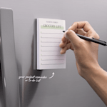 A personalised notepad featuring a family's grocery list.