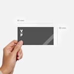 A business card measuring 55 x 91 mm.