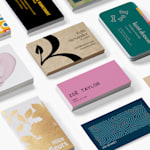 A business card promoting a jewellery store, doubling as a display card for earrings.