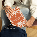 A person keeping their custom wraparound spiral notebook in a bag. An arrow points to its A5 size and 80 inner pages.