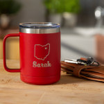 A 15 oz. red travel mug laser etched with the name Sarah and the outline of a US state.