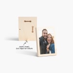 A front and back view of a tabletop wood print featuring a photo of a couple smiling, with a note that you can insert a dowel for tabletop display.