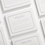 A letterpress enclosure card with elegant script and an antique-style border.