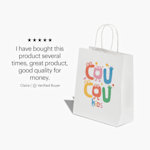 A white standard paper bag from a kids’ entertainment store, with a testimonial from a verified customer: “I have brought this product several times, great product, good quality for money.”