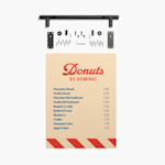 A menu board showing a menu for a donut shop with pricing. Above the menu bar the included pieces for assembly are shown.