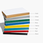 A stack of blank painted edge cards labeled by their edge colors; gold, silver, green, blue, yellow, teal, red, and black.  