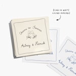 A stack of white and ecru cocktail napkins customized for a wedding, with a note that ecru and white colors are available. 