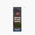 A bookmark customized for a realty business with dimensions indicating it is 2 inches wide and 6 inches tall. 