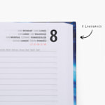 A close-up of an open, hardcover diary. There’s a note that there are 8 languages featured on the pages.