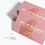 A stack of bamboo business cards for a nail salon, featuring a note highlighting their distinctive bamboo texture.