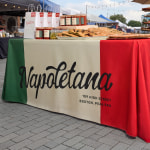 edge of a rectangle tablecloth with company logo 
