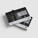 A stack of postcards advertising an estate agency.