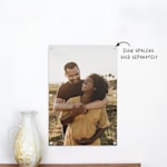 An acrylic print featuring a young couple’s maternity photo. 