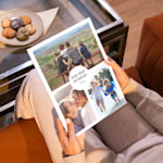 A closed photo book featuring a collage of family photos on its cover.