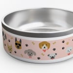 A pink personalised dog bowl printed with various dog designs, as well as dog bones and paw prints. 